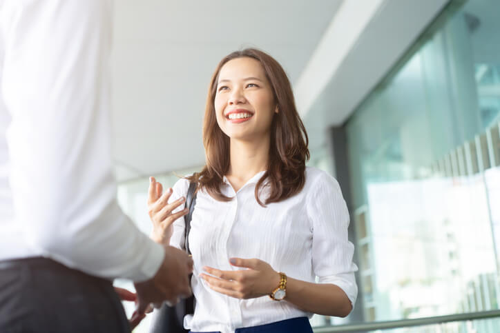 Female community support worker having a conversation with a colleague