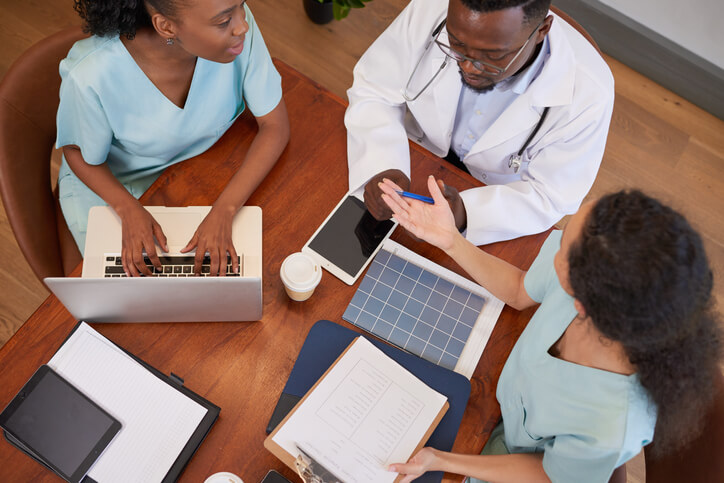 Healthcare practitioners talking in nursing school