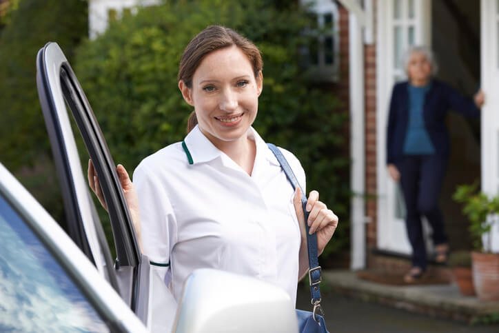 Female support worker visiting an elderly client after community support worker training