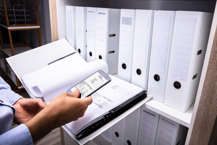 A dental assistant backing up client records per dental assistant courses