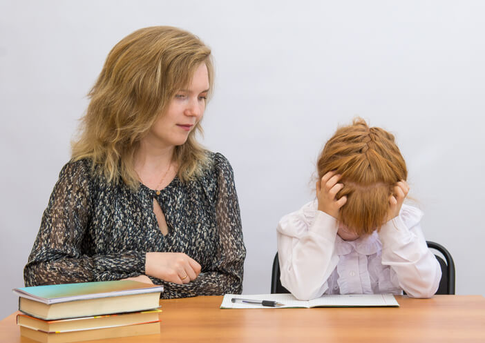 community service worker training grad patiently assisting an upset student.