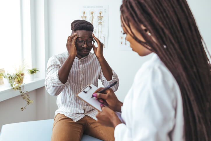 A female practical nurse interacting with a patient after her practical nurse training.
