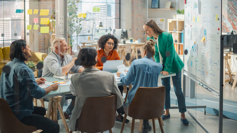 A team of digital marketing training graduates in a meeting