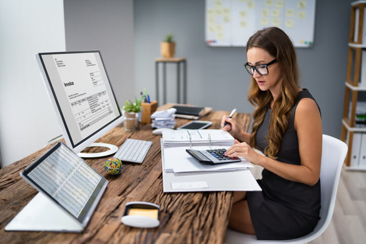 A finance business management training grad using accounting software