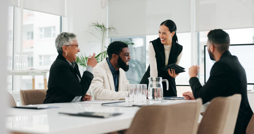 A male CEO interacting with company employees after completing his business management and finance courses