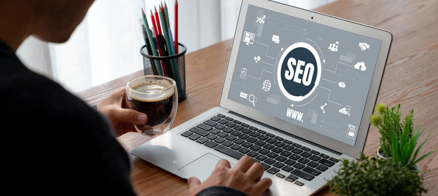 Male SEO expert working from home after completing his digital marketing training